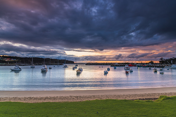 Seaside harbour overcast seascape with boats