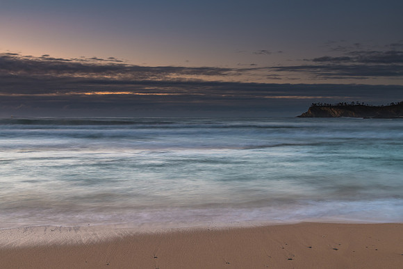 Sunrise seascape and low cloud bank
