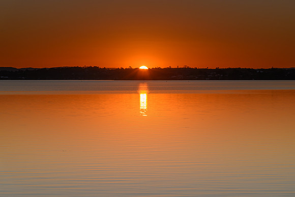 Sunset over the Lake with Clear Skies