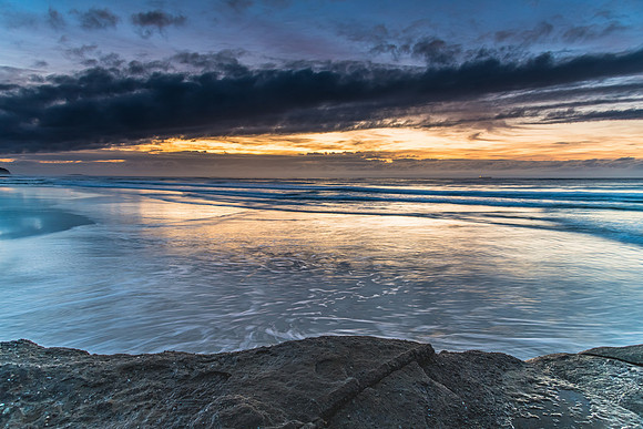 Sunrise Seascape with Clouds and Ships on the Horizon