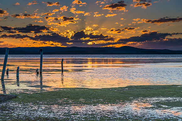 Sunset lights up the sky over the Lake