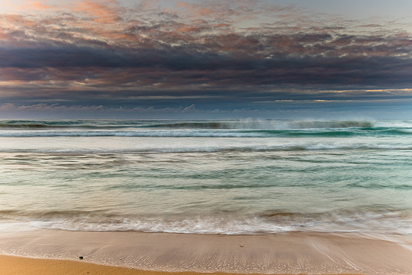 Sunrise seascape and low cloud bank