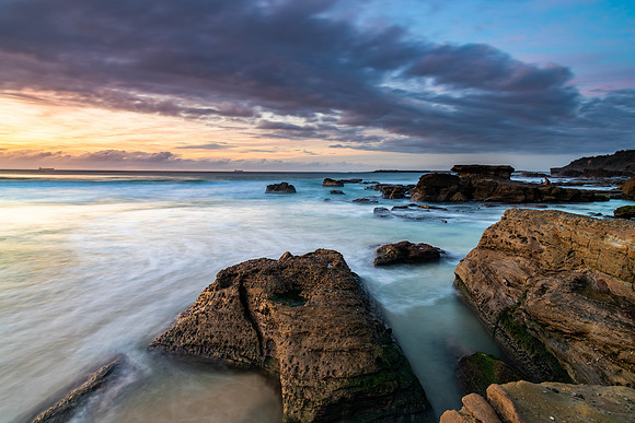 Sunrise Seascape with Clouds and Ships on the Horizon