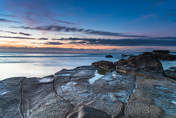 Sunrise Seascape with Clouds and Ships on the Horizon