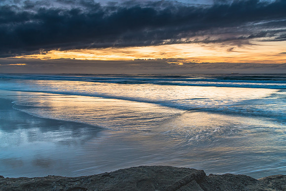 Sunrise Seascape with Clouds and Ships on the Horizon