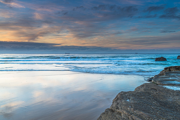 Sunrise Seascape with Clouds and Ships on the Horizon