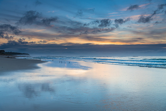 Sunrise Seascape with Clouds and Ships on the Horizon