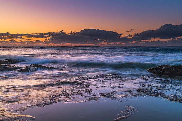 Sunrise Seascape with a low cloud bank