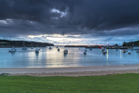 Seaside harbour overcast seascape with boats