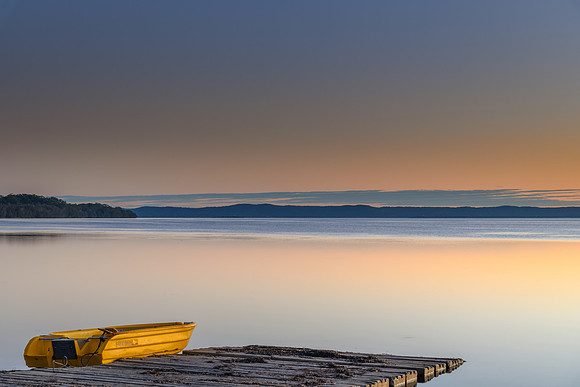 Sunset over the Lake with yellow boat