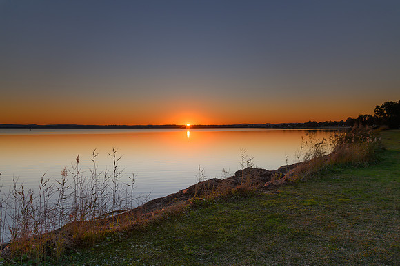 Sunset over the Lake with Clear Skies