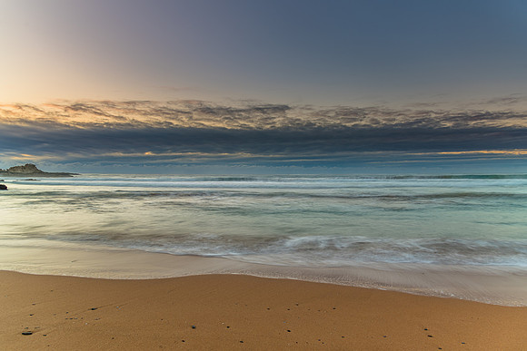 Sunrise seascape and low cloud bank