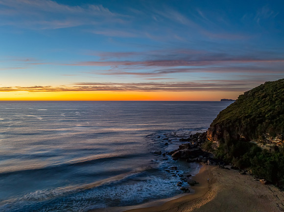 Sunrise at the seaside with high cloud