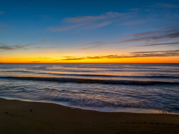 Sunrise at the seaside with high cloud