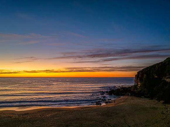Sunrise at the seaside with high cloud