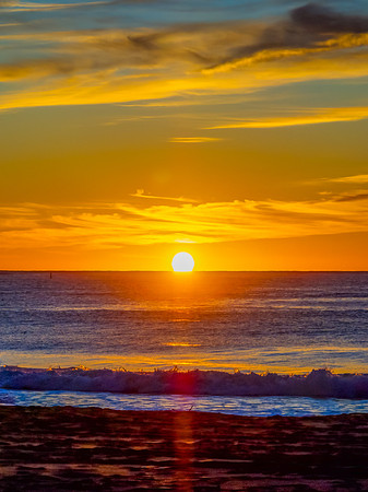 Sunrise at the seaside with high cloud
