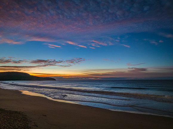 Winter seascape views over the beach with high and medium cloud