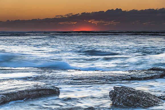 Sunrise Seascape with a low cloud bank