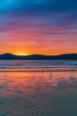 Colourful cloud filled sunrise at the seaside