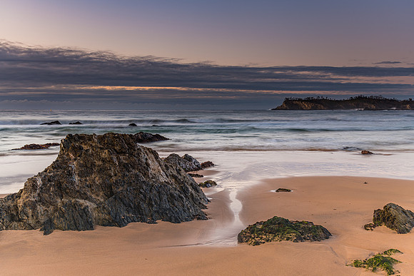 Sunrise seascape and low cloud bank
