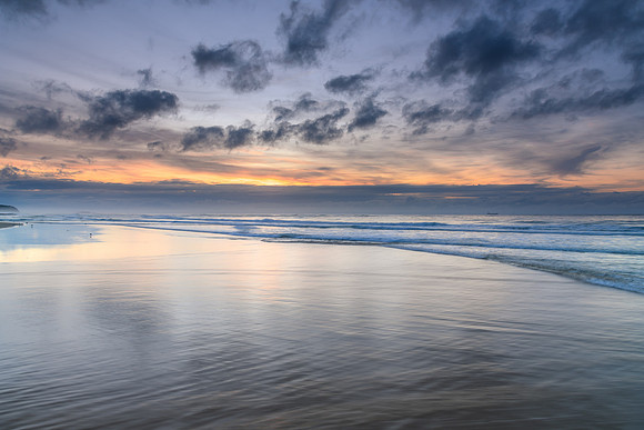 Sunrise Seascape with Clouds and Ships on the Horizon