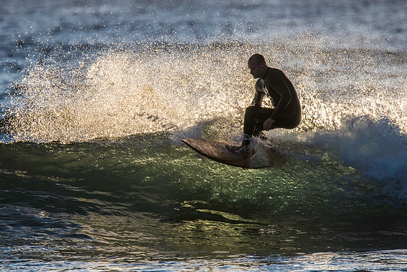 Surfers and Sunrise at the seaside