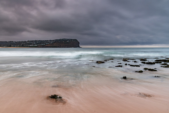 Rainy day sunrise at the beach