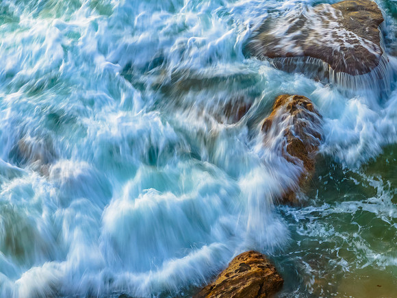 Rocks and sea action in the early morning light