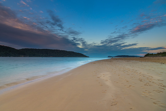 Along the beach with high clouds over the channel