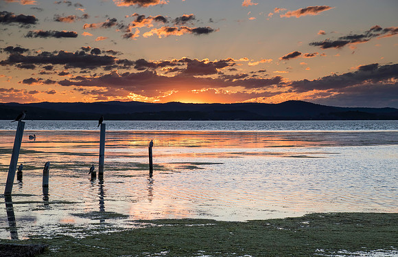 Sunset lights up the sky over the Lake