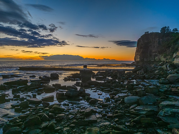 Sunrise over the ocean and rocky Inlet
