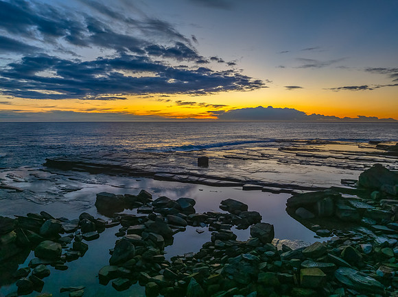 Sunrise over the ocean and rocky Inlet