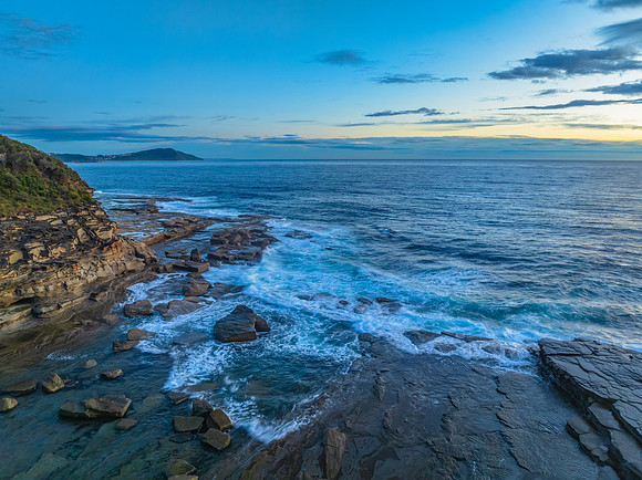 Sunrise over the ocean and rocky Inlet