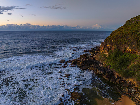 Aerial sunrise at the beach with clouds