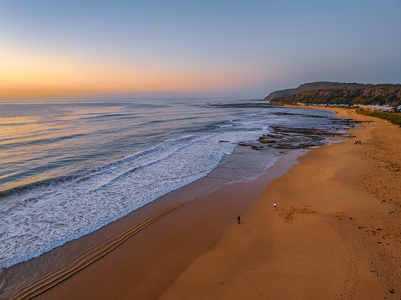 Aerial sunrise at the beach with clear skies