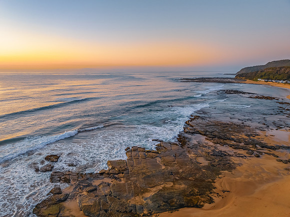 Aerial sunrise at the beach with clear skies