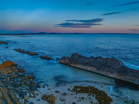 Coastal Sunrise with Rock Formations
