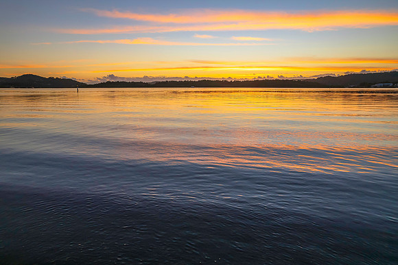 Sunrise over the bay with clouds
