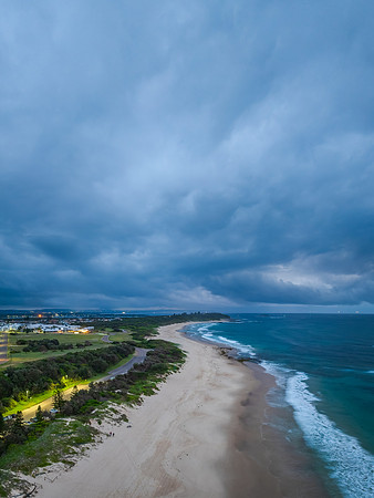 Sunrise Seascape with beautiful cloud covered sky and gentle sur