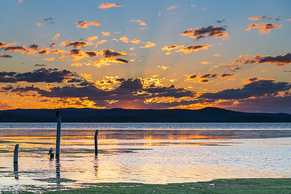 Sunset lights up the sky over the Lake