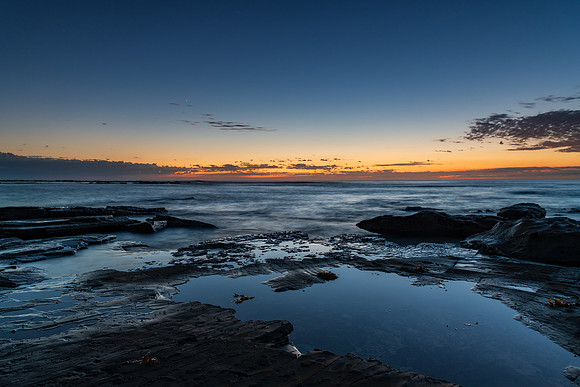 Rocky coastline sunrise seascape