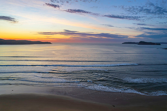 Sunrise seascape with a mix of high and medium clouds