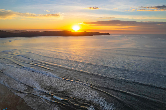 Sunrise seascape with a mix of high and medium clouds