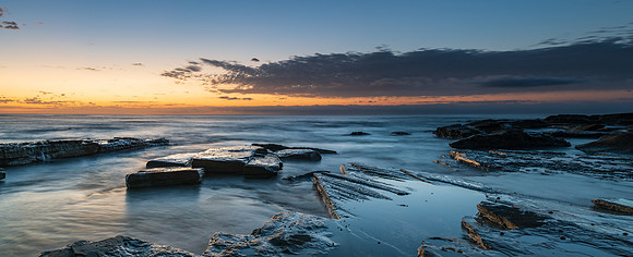 Rocky coastline panorama sunrise seascape