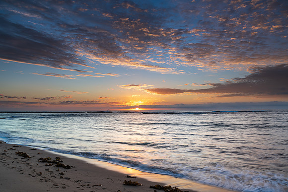 Sun rising on the horizon seascape