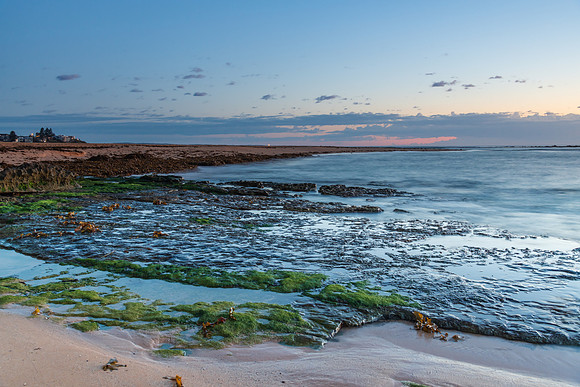 Rocky coastline sunrise seascape