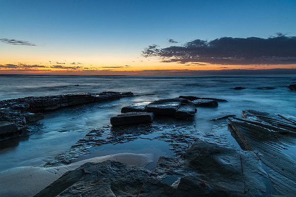 Rocky coastline sunrise seascape