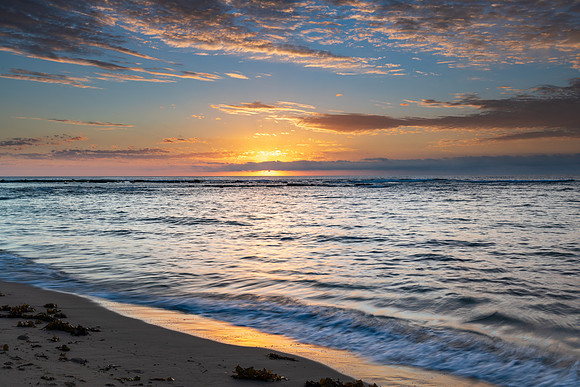 Sun rising on the horizon seascape