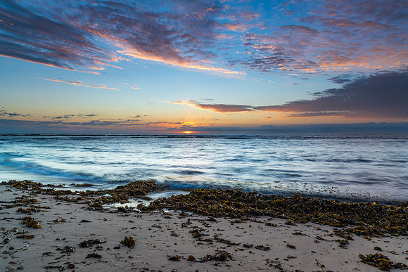Sun rising on the horizon seascape