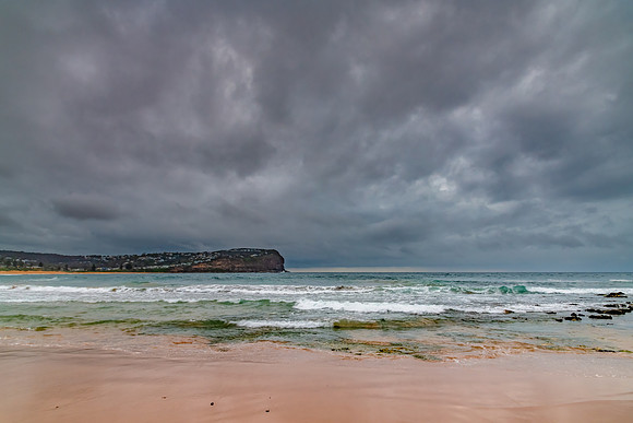 Rainy day sunrise at the beach